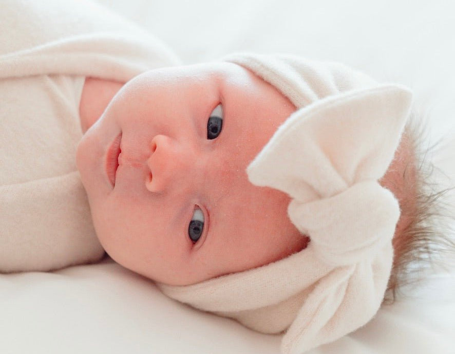 Adorable baby bow headwrap available in luxurious Plush Latte.