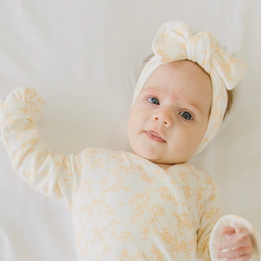 Adorable bow headwrap available in luxurious silky modal with Bitty Blooms design.