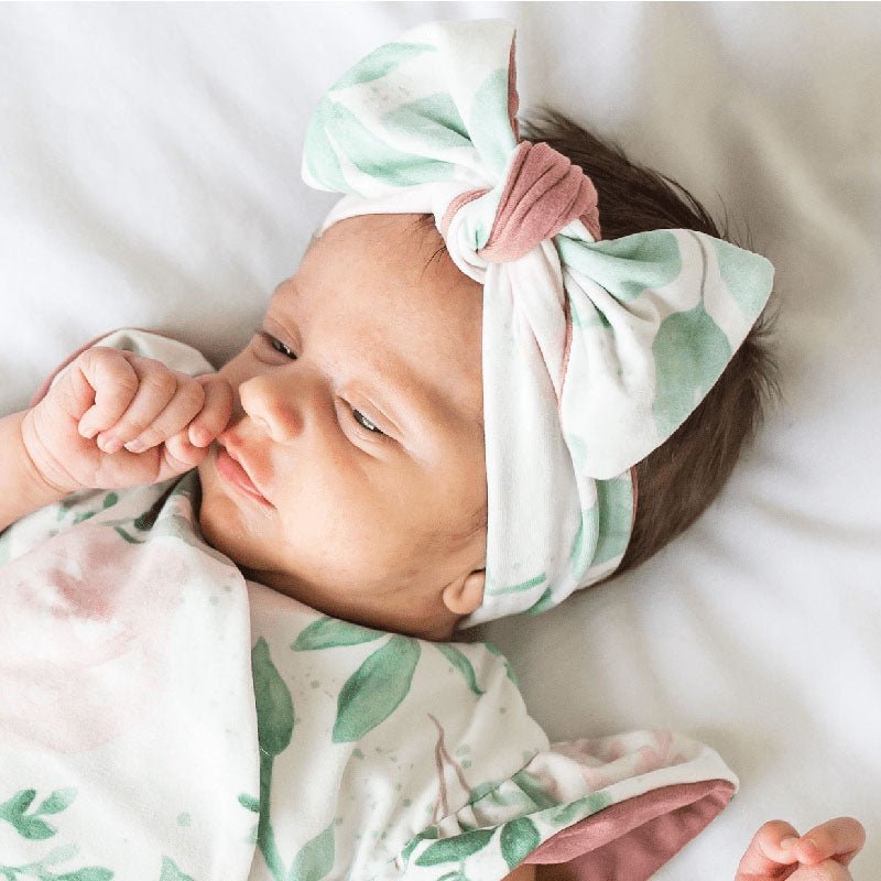 Headwrap with bow in Blushing Eucalyptus design, made from classic brushed fabric.