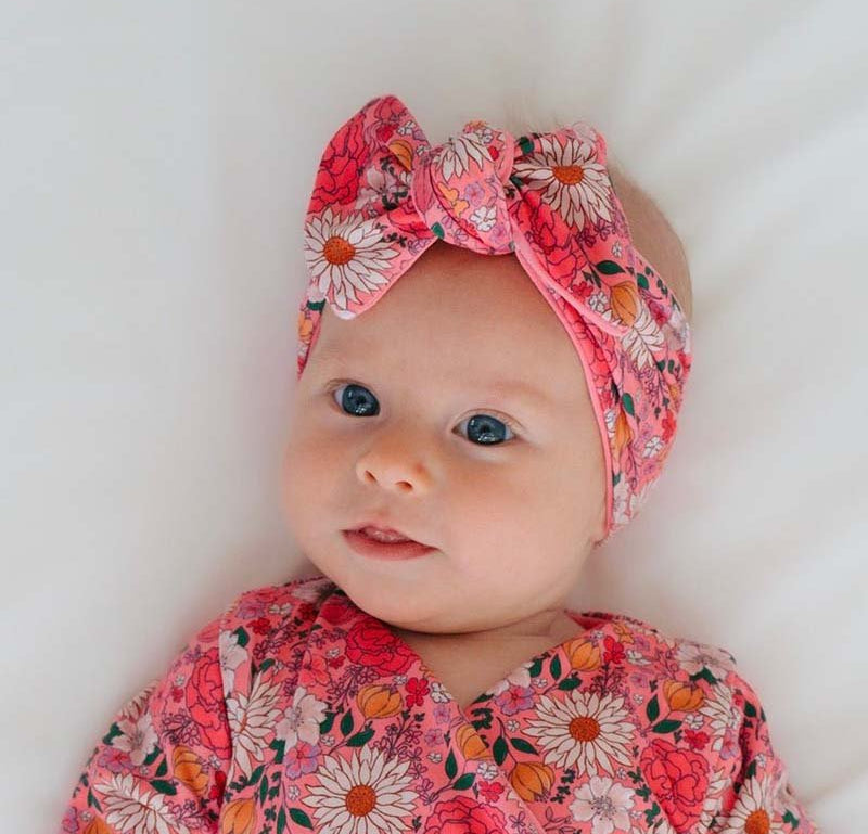 Headwrap with bow in Flower Power design, made from classic brushed fabric.
