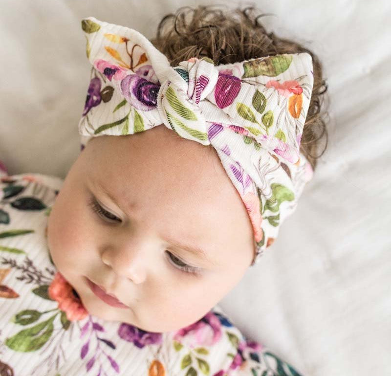 Headwrap with bow in Ivory Wildflowers design, made from classic brushed fabric.