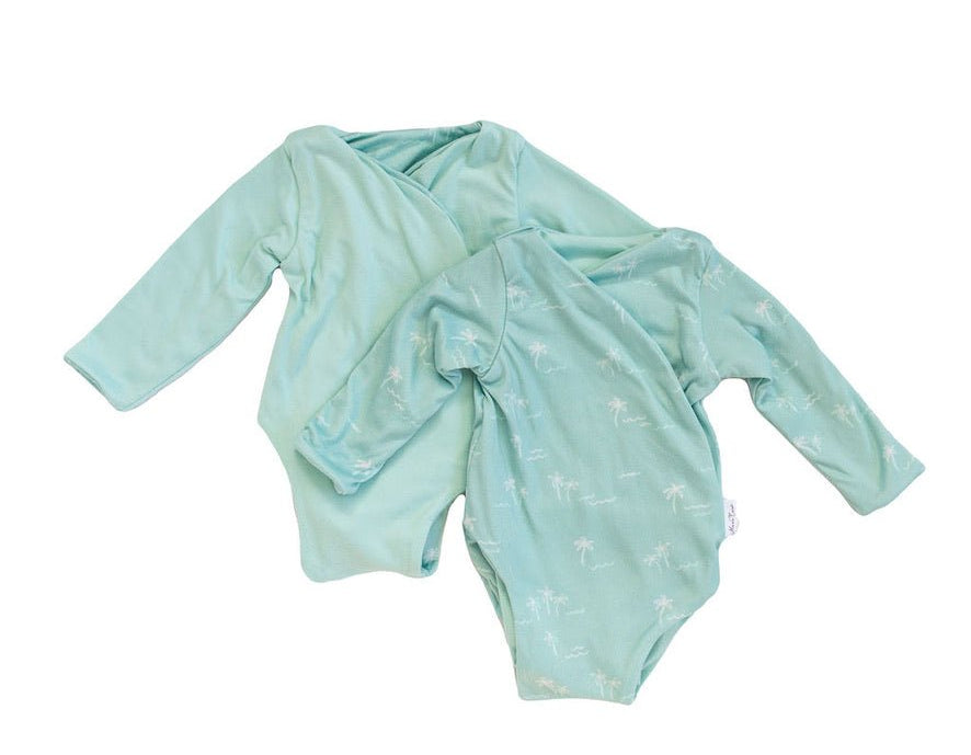 Honeydew palms design long-sleeve baby onesie in classic brushed fabric.