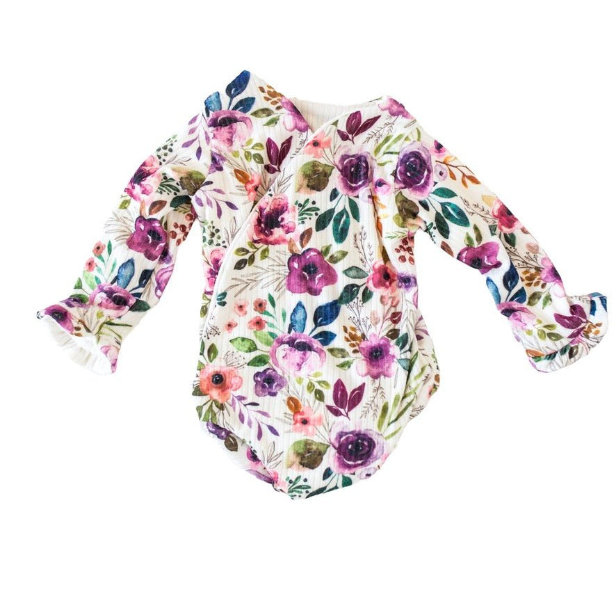 Classic brushed fabric baby bodysuit in Ivory Wildflowers design with long sleeves, winged, and ruffle cuffs.
