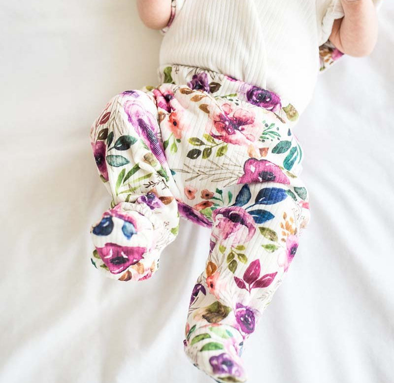 Footie pants in ivory wildflowers design.