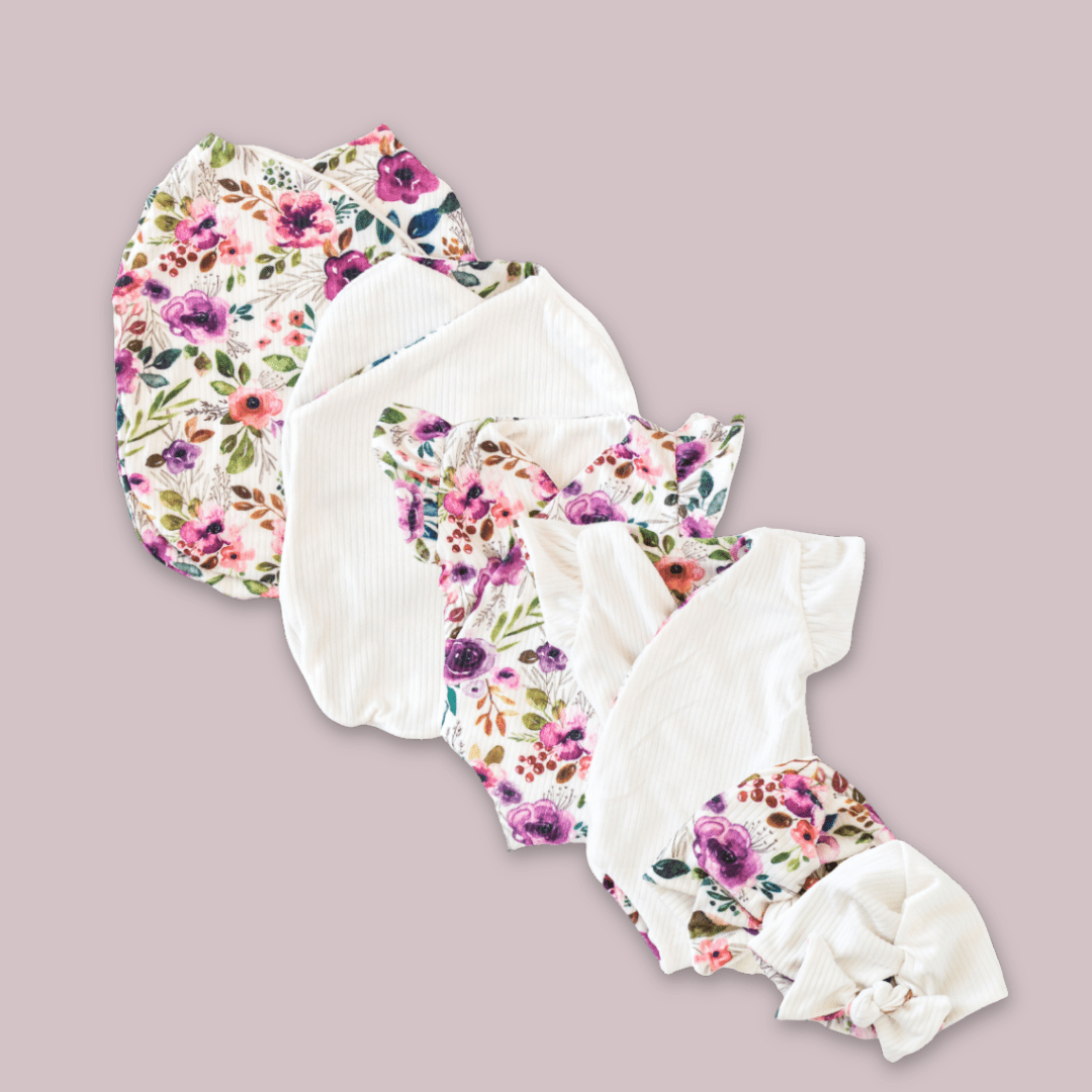 Newborn essentials bundle with flutter sleeves in classic brushed fabric with ivory wildflowers design.