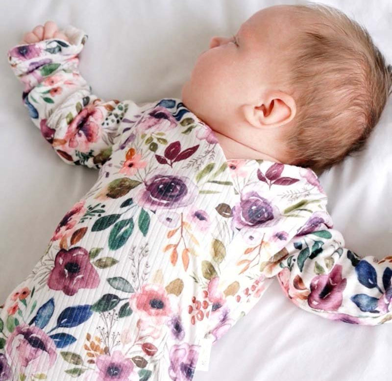 Ruffle cuff baby bodysuit with wings in Ivory Wildflowers design classic brushed fabric.