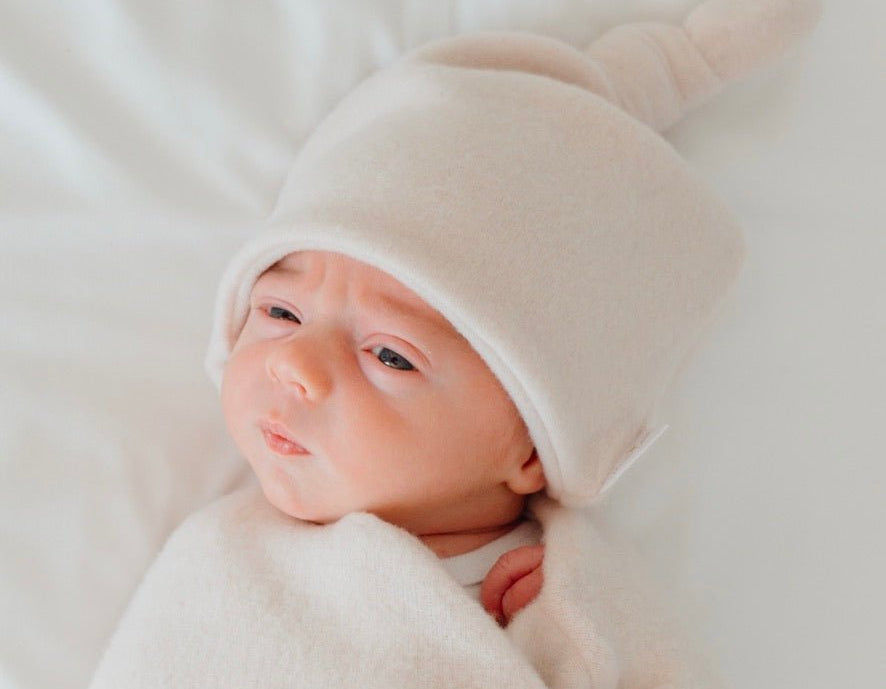 Knotty beanie in Plush Latte design, made from Plush Dream fabric.