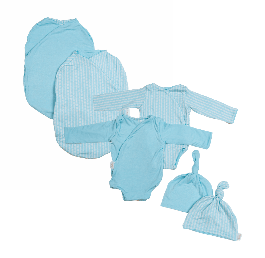 Newborn bundle with long sleeve essentials in silky modal fabric with lil surfer design.