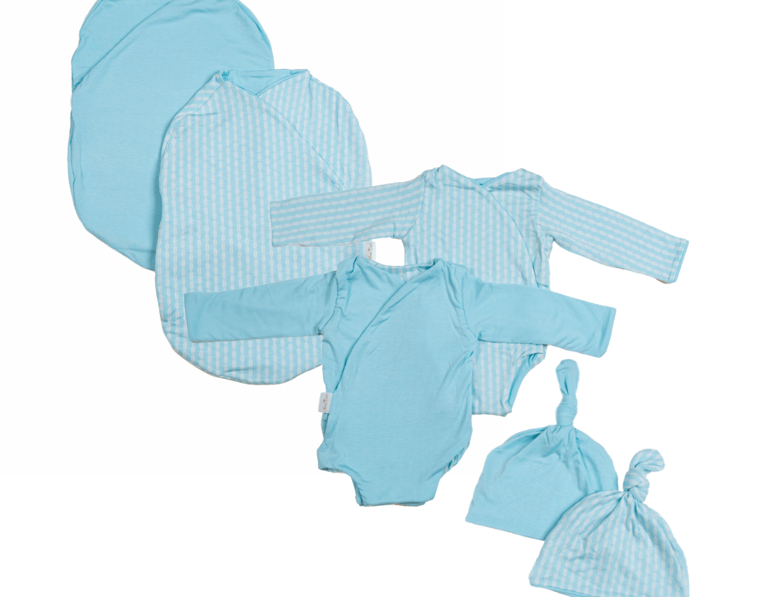 Newborn bundle with long sleeve essentials in silky modal fabric with lil surfer design.