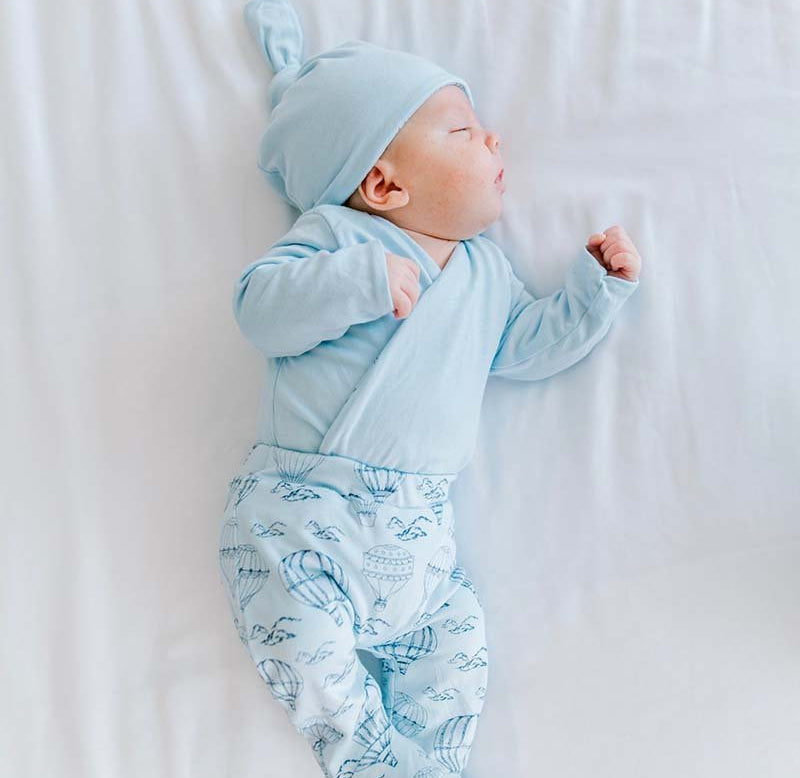 Reversible long-sleeve baby onesie outfit bundle made from bamboo cotton in bon voyage design.