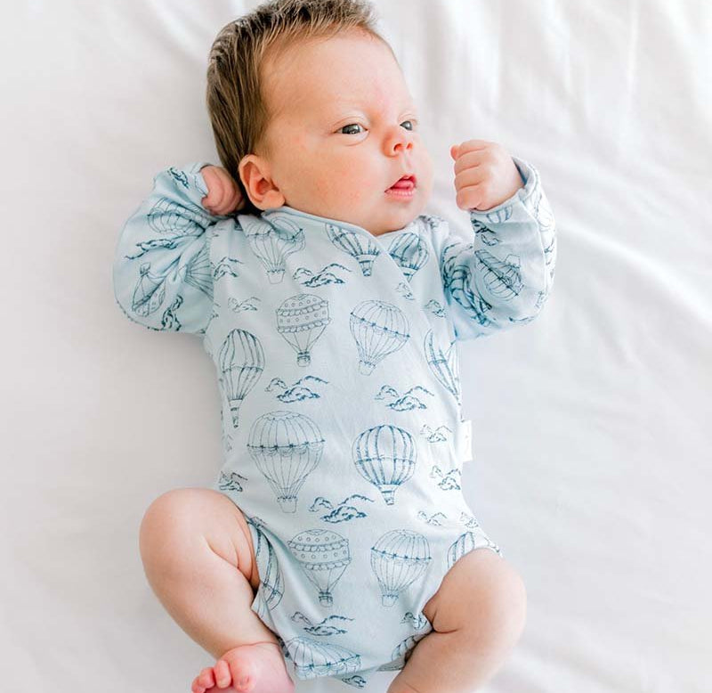 Long-sleeve baby onesie outfit bundle made from bamboo cotton in bon voyage design.