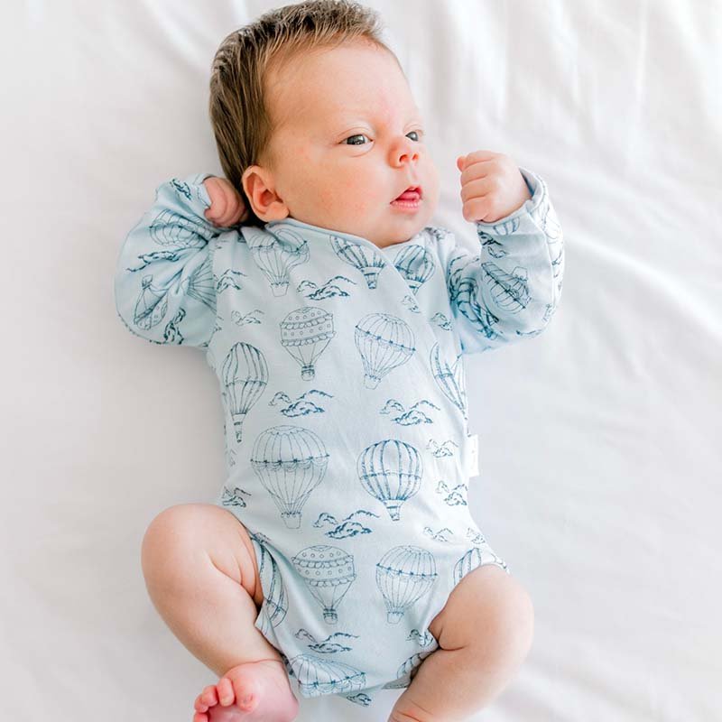 Long-sleeve baby onesie outfit bundle made from bamboo cotton in bon voyage design.