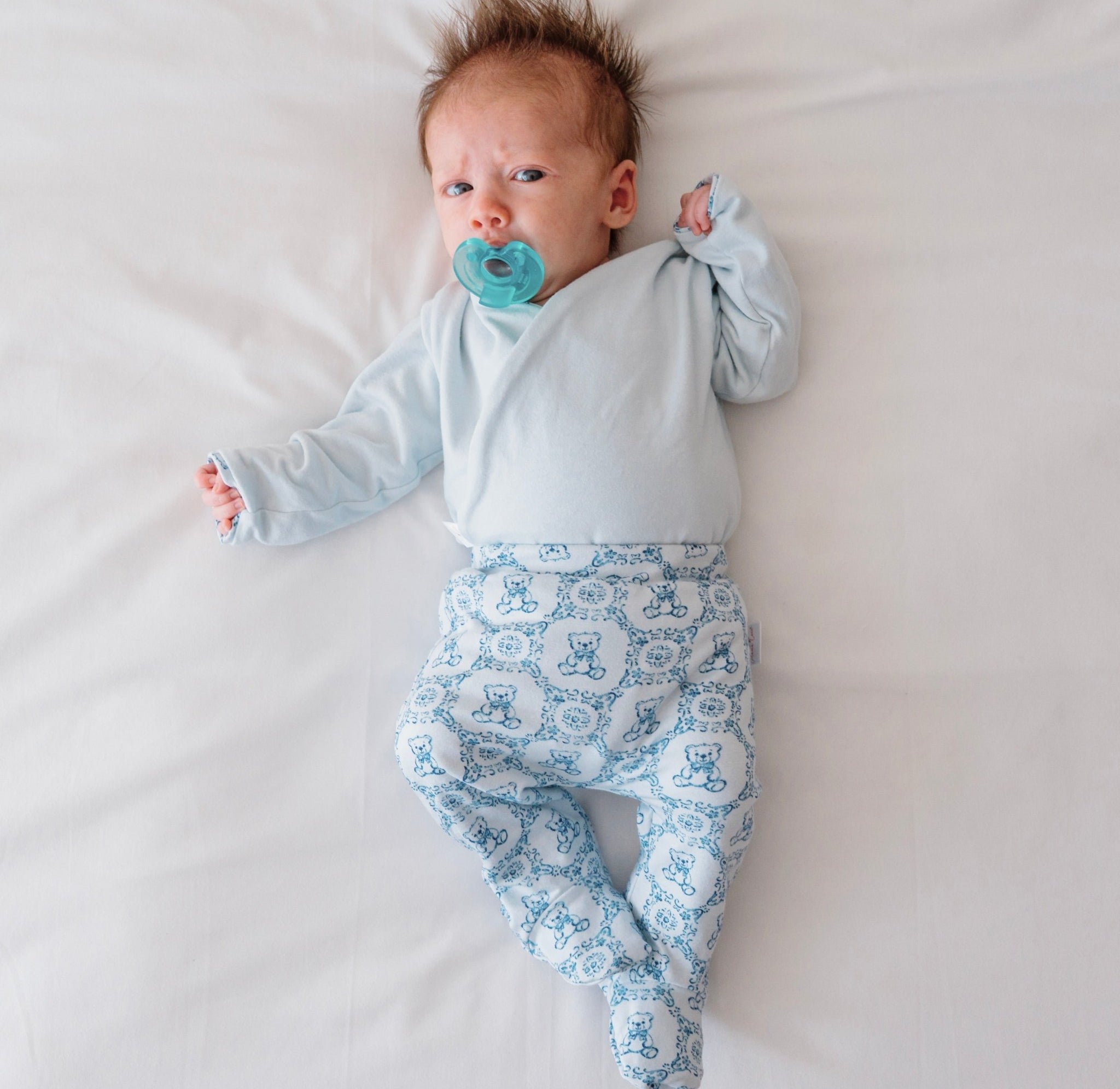 Reversible long-sleeve baby onesie outfit bundle in teddy tiles design.