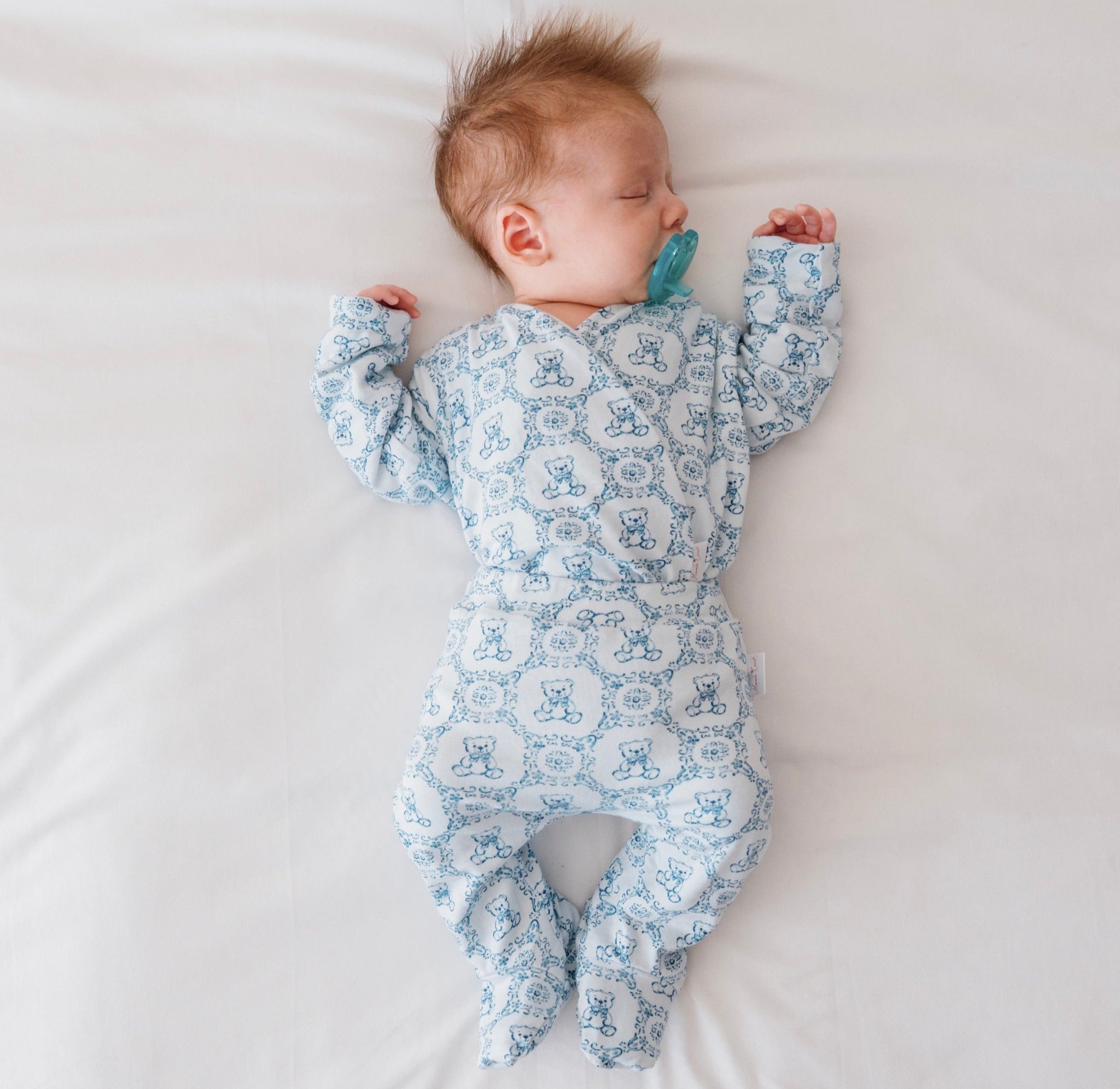 Long-sleeve baby onesie outfit bundle made from bamboo cotton in teddy tiles design.