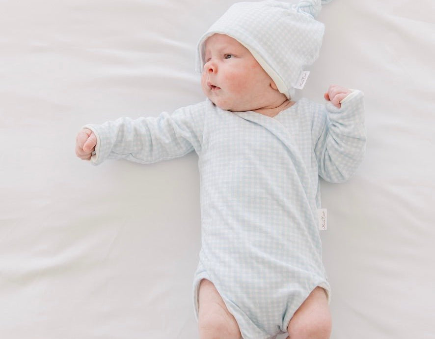 Long-sleeve onesie outfit bundle in baby blue gingham design.