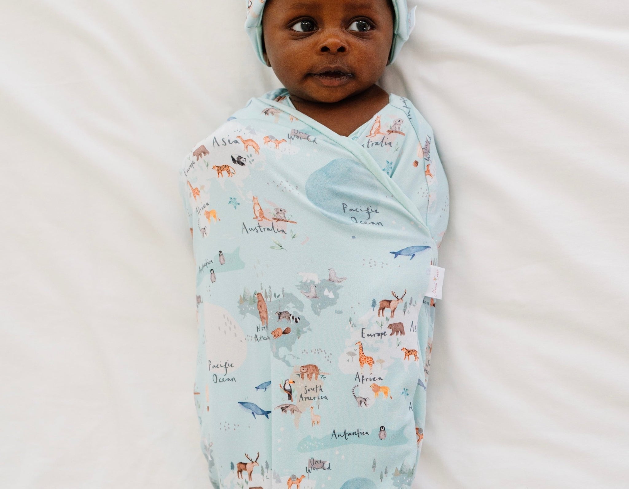 Classic brushed long sleeve newborn essentials bundle in world traveler design.