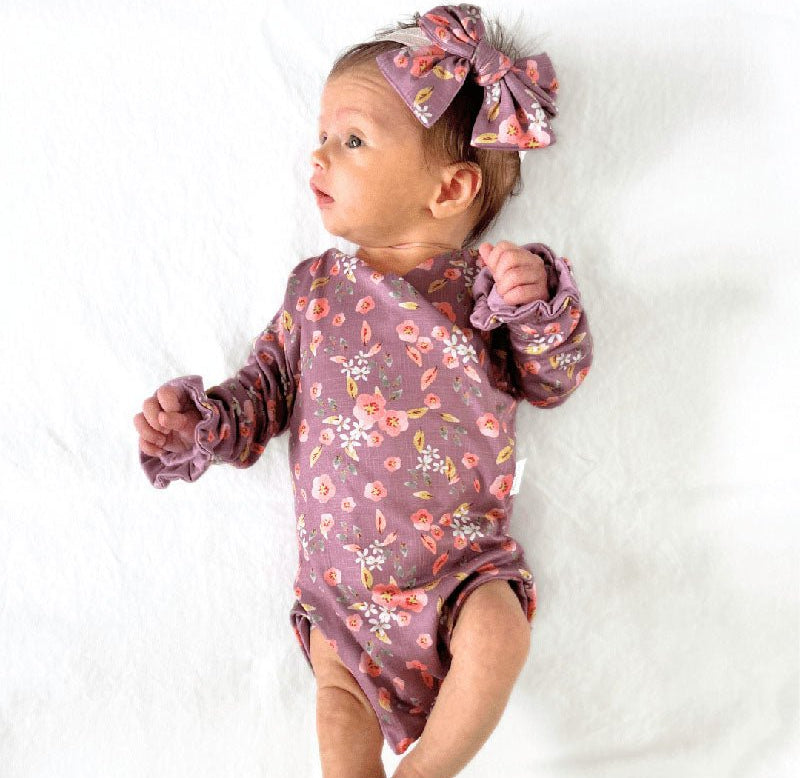 Classic brushed fabric baby bodysuit in Peachy Lilac design with long sleeves, winged, and ruffle cuffs.