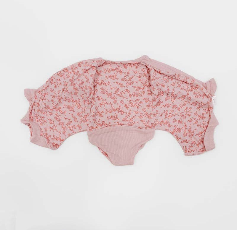 Long sleeved winged bodysuit for babies in silky modal fabric.