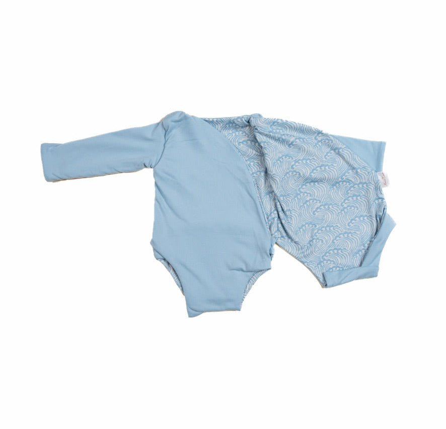 Long-sleeved winged bodysuit for babies in classic brushed fabric.