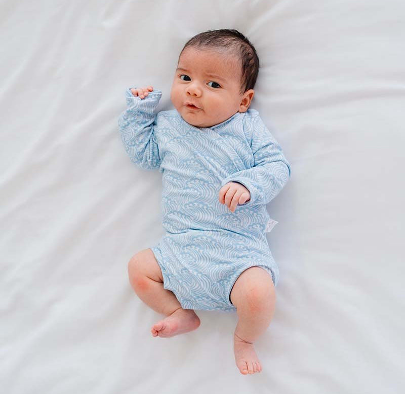 Blue Swells design long sleeve winged bodysuit.