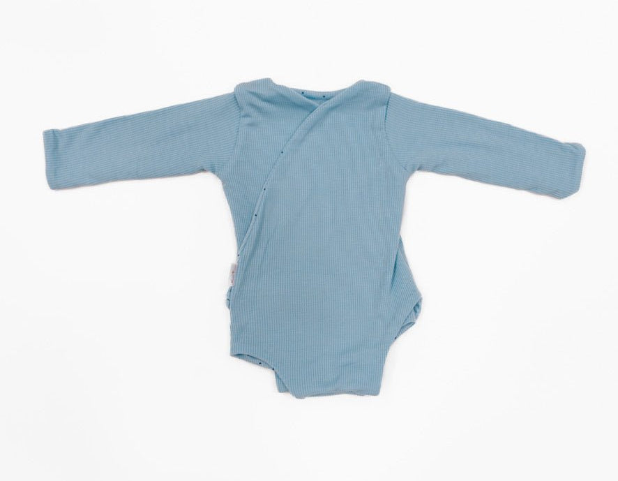 Reversible baby winged bodysuit in Dotted Blues design.
