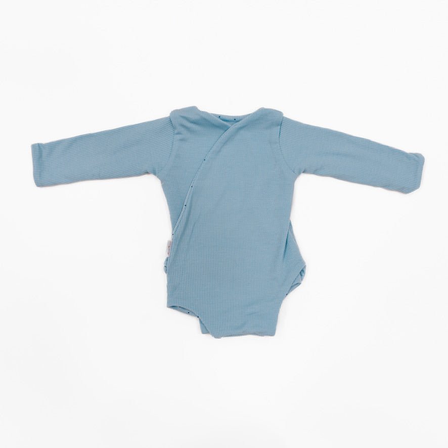Reversible baby winged bodysuit in Dotted Blues design.