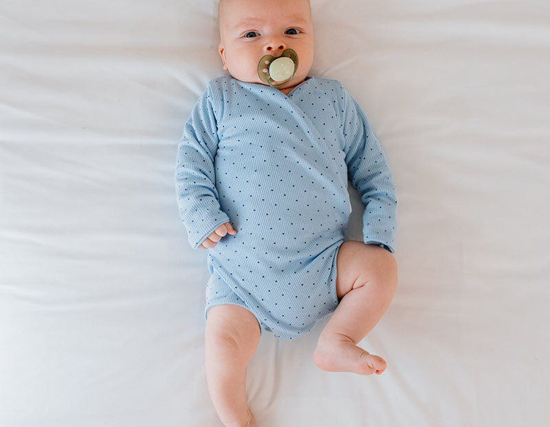 Dotted Blues design long sleeve winged bodysuit.