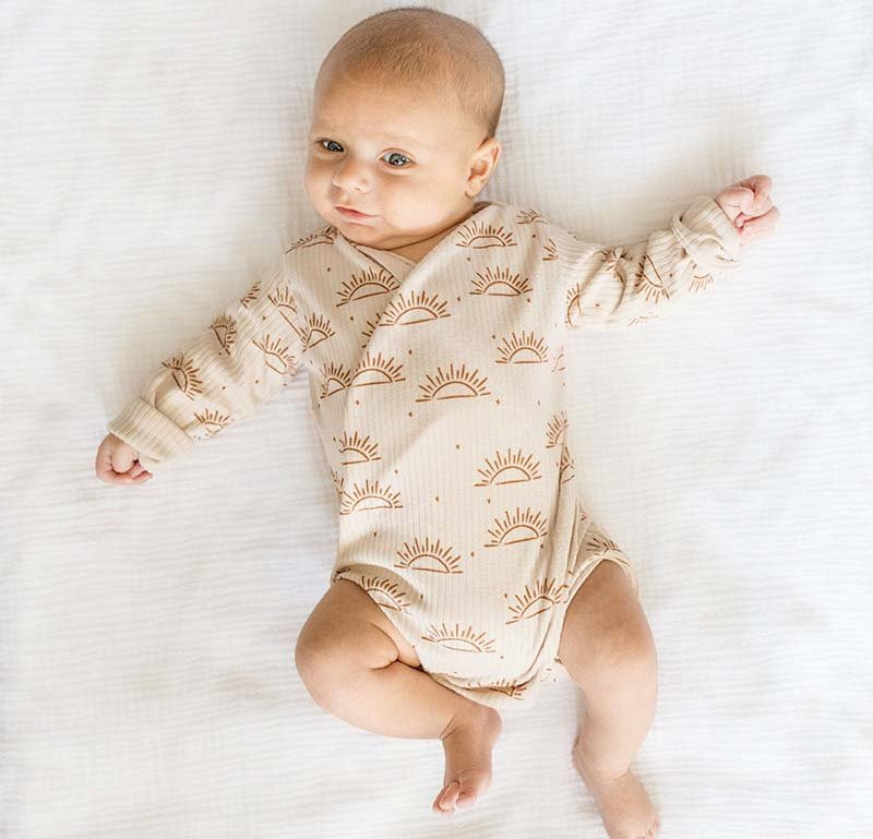 Sandy Sunsets design, long-sleeved winged bodysuit.