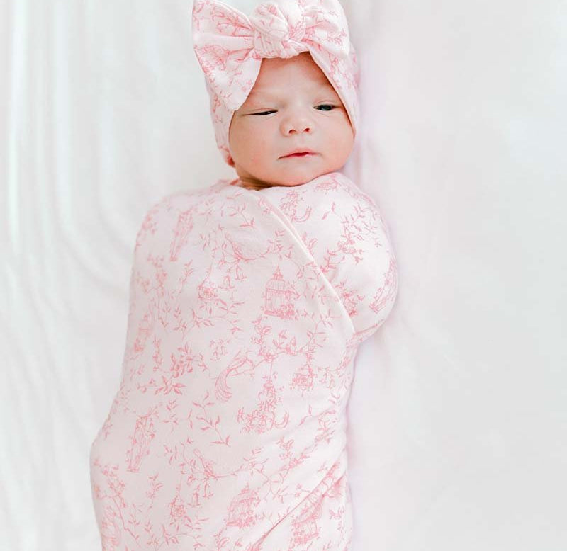 Bamboo cotton flutter sleeve newborn essentials bundle in whimsical garden design.