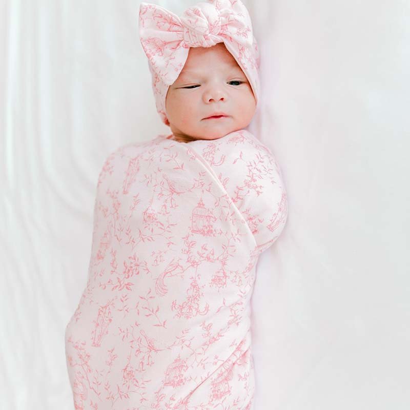 Bamboo cotton flutter sleeve newborn essentials bundle in whimsical garden design.