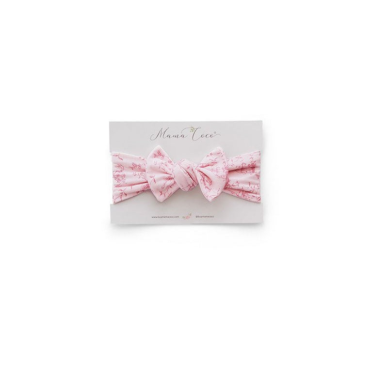 Our bamboo cotton baby headwrap in whimsical garden design.