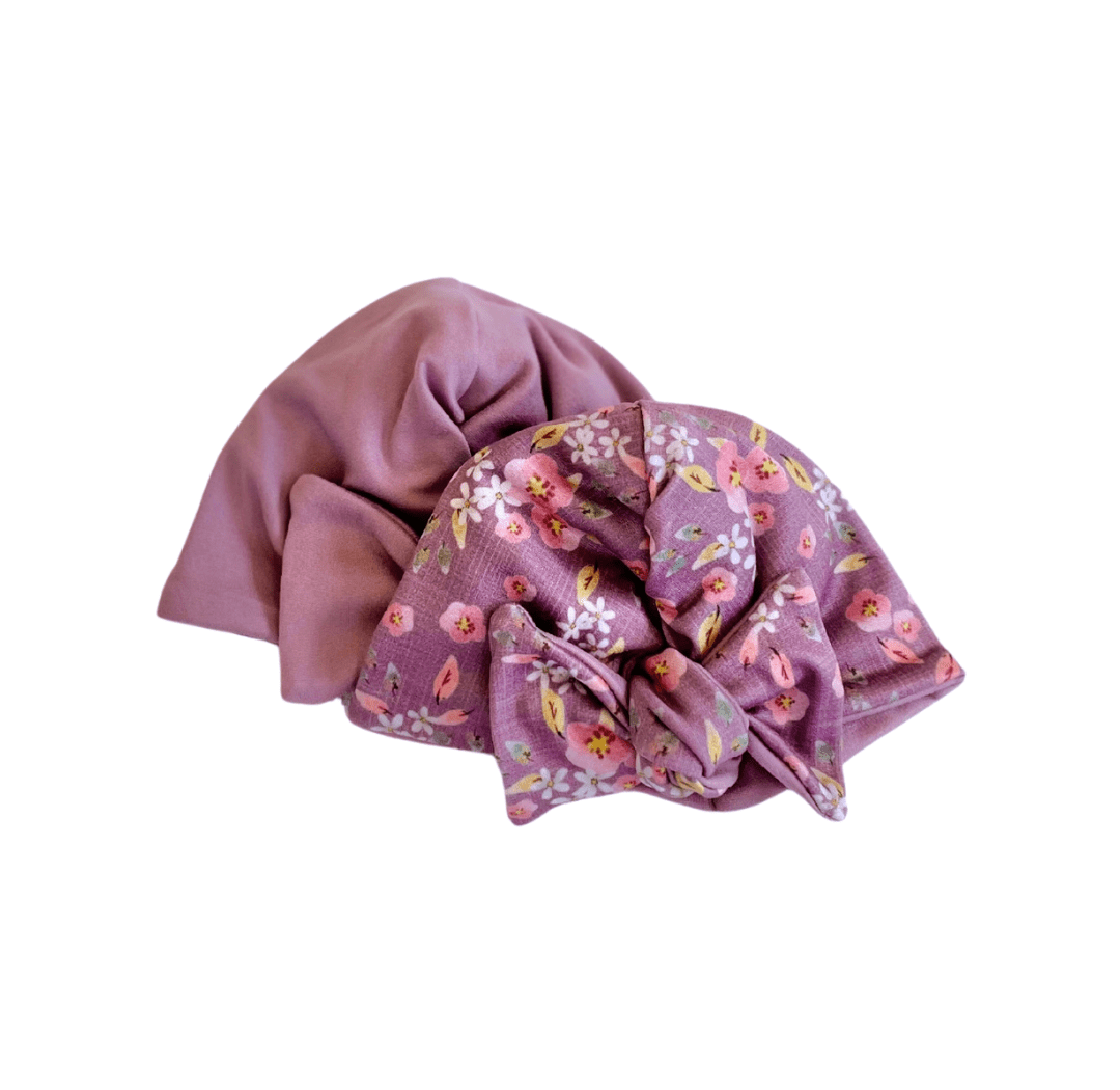 Reversible classic brushed baby knotty beanie in peachy lilac design.