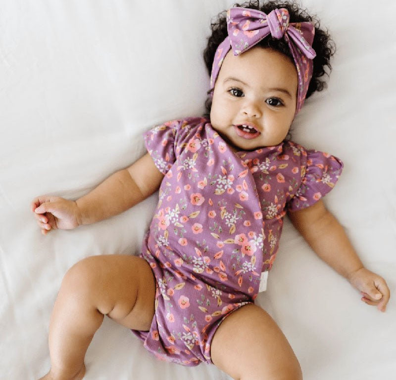 Short-sleeve bodysuit for baby in Classic Brushed fabric styles featuring Peachy Lilac.