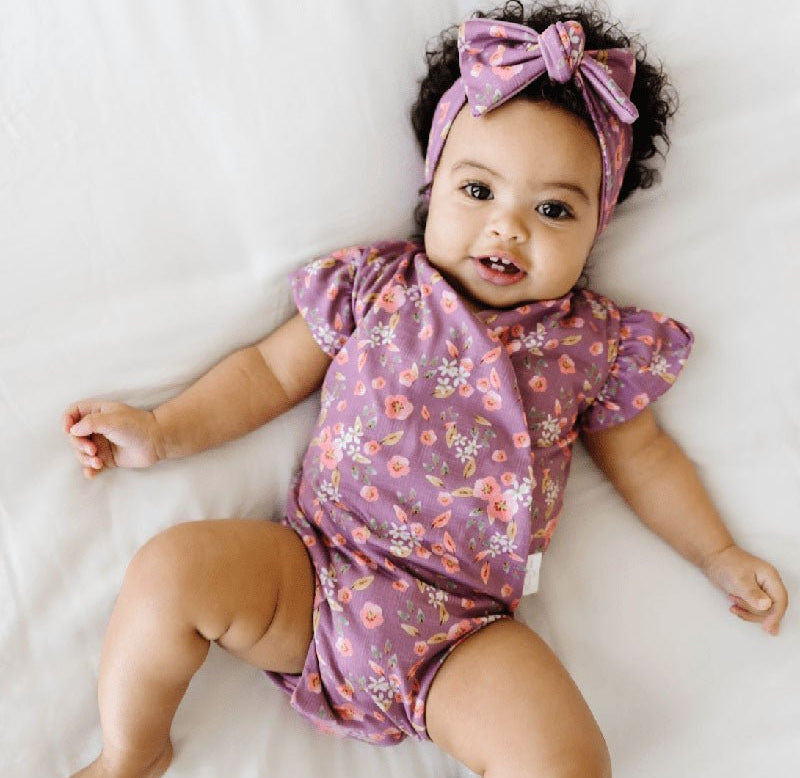 Short-sleeve bodysuit for baby in Classic Brushed fabric styles featuring Peachy Lilac.
