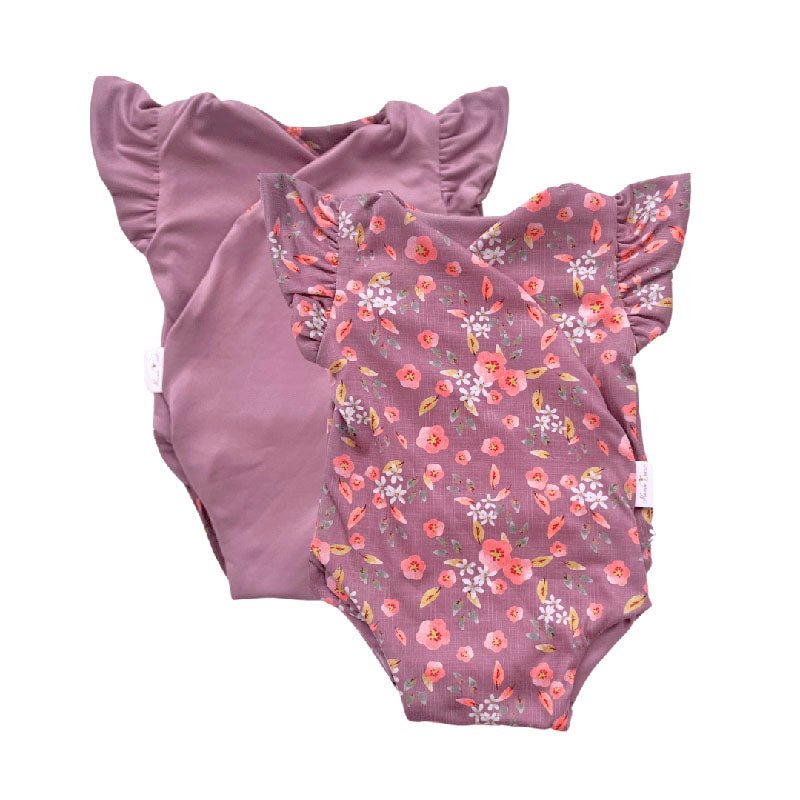 Reversible short-sleeve bodysuit for baby showcasing Peachy Lilac and soft brushed fabric.
