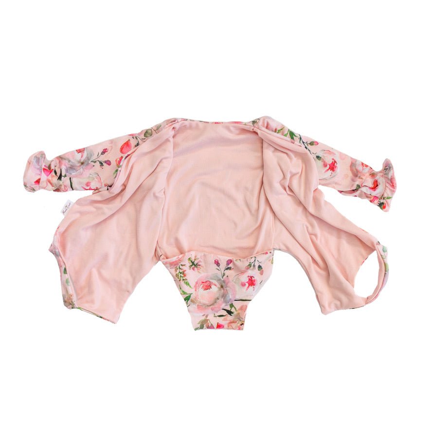 Boutique-style long sleeve baby bodysuit with ruffle cuff accents in Peachy Rose Fields design brushed fabric.