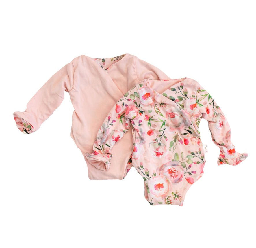 Long-sleeved winged baby bodysuit featuring ruffle cuffs in soft Peachy Rose Fields design brushed fabric.