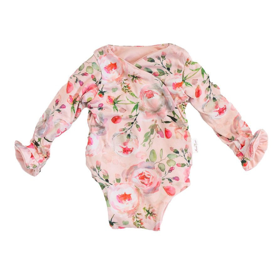Soft Peachy Rose Fields design brushed fabric baby bodysuit with winged sleeves and elegant ruffle cuffs.