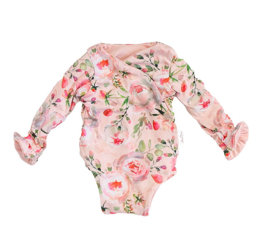 Soft Peachy Rose Fields design brushed fabric baby bodysuit with winged sleeves and elegant ruffle cuffs.