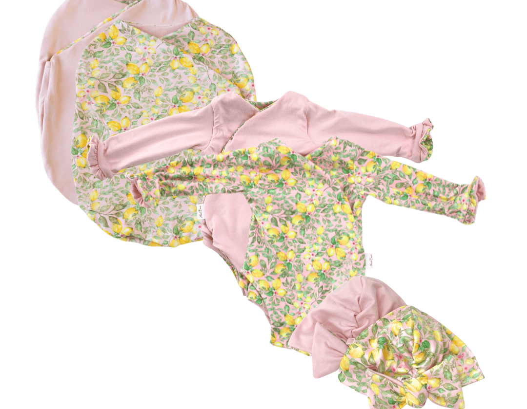 Classic brushed long sleeve newborn baby bundle, featuring adorable ruffle cuffs in pink lemonade design.