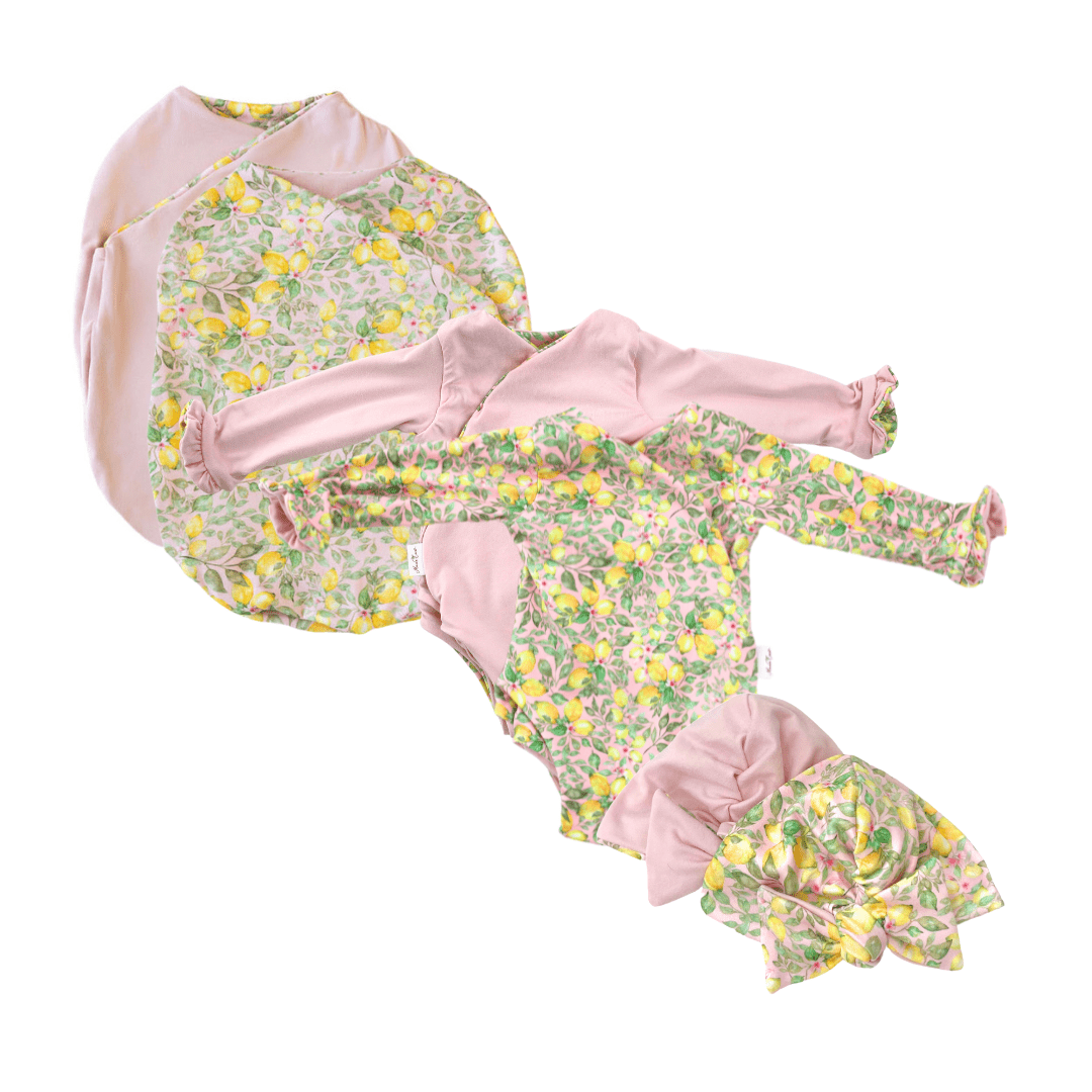 Classic brushed long sleeve newborn baby bundle, featuring adorable ruffle cuffs in pink lemonade design.
