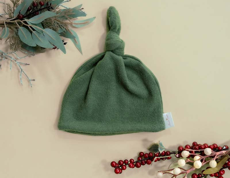 Knotty beanies crafted in soft Plush Juniper Pine fabric.