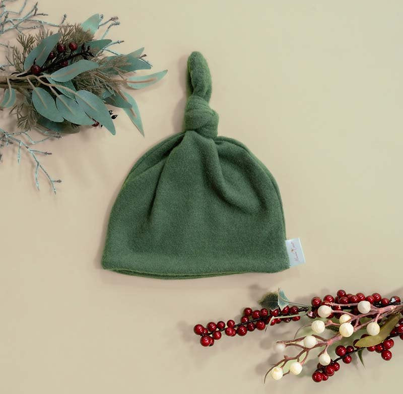 Knotty beanies crafted in soft Plush Juniper Pine fabric.