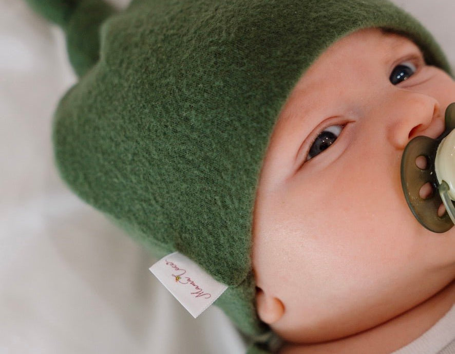 Adorable knotty beanie available in luxurious Plush Juniper Pine fabric.