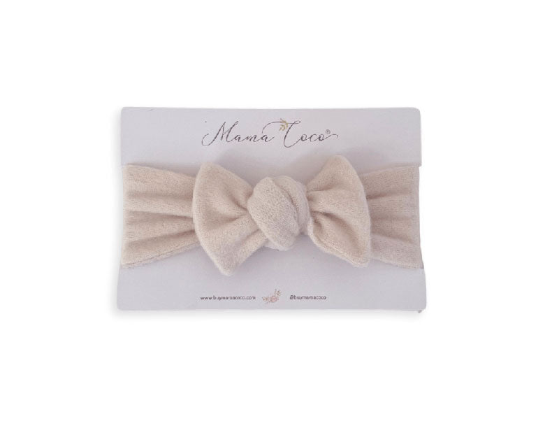 Headwrap with bow for baby in Plush Latte fabric styles.