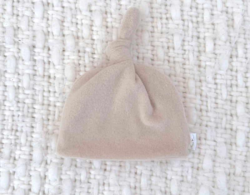 Adorable knotty beanie available in luxurious Plush Latte fabric.