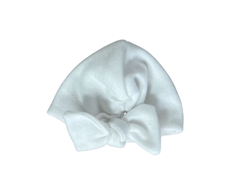 Ruched beanie with bow crafted in soft Plush Perfection design Plush Dream fabric.