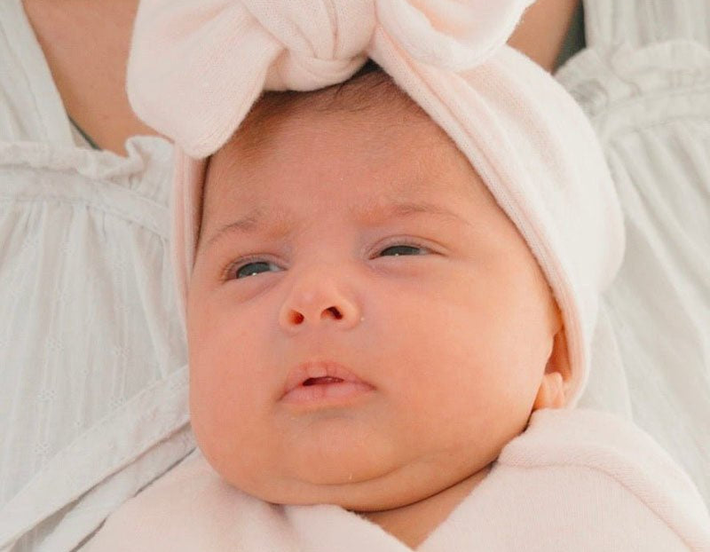 Baby headwrap with bow crafted in soft Plush Pink Cashmere fabric.