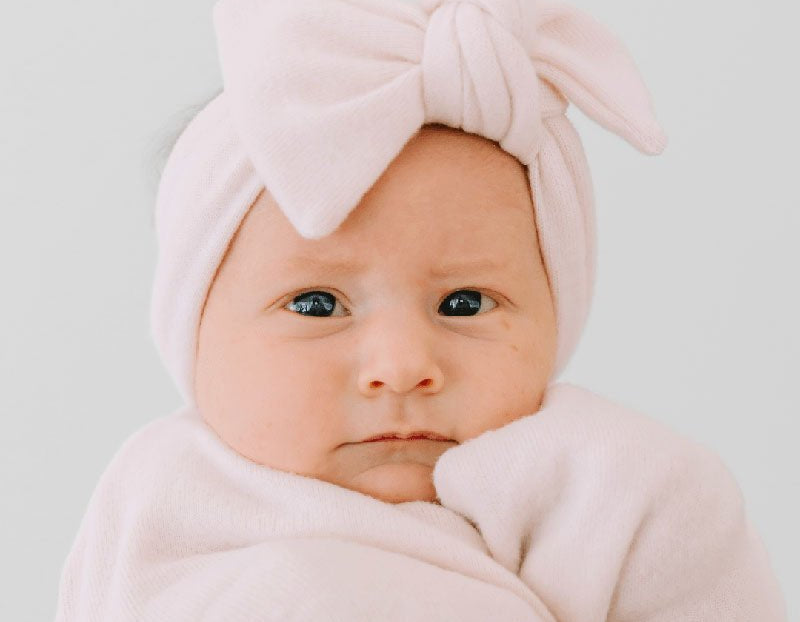 Adorable baby bow headwrap available in luxurious Plush Pink Cashmere.
