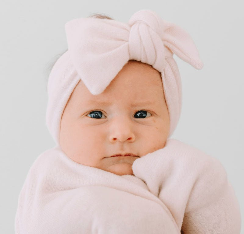 Adorable baby bow headwrap available in luxurious Plush Pink Cashmere.